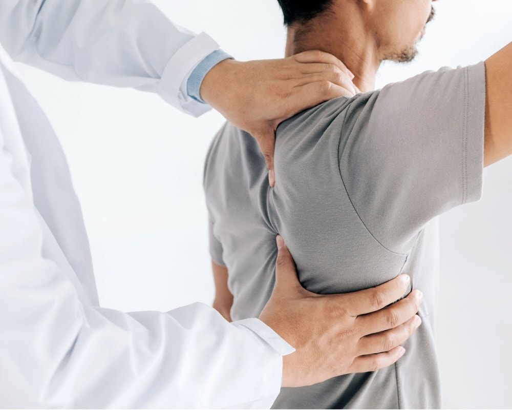 Doctor examining a patient's shoulder
